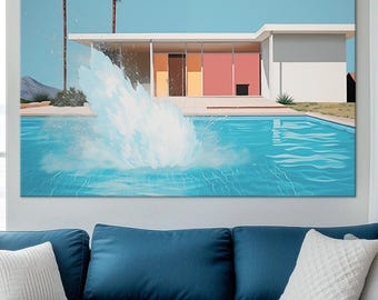 May include: A modern living room featuring a large blue sectional sofa with white throw pillows. A large painting of a pool scene hangs above the sofa. A white coffee table with decor sits in front of the sofa.