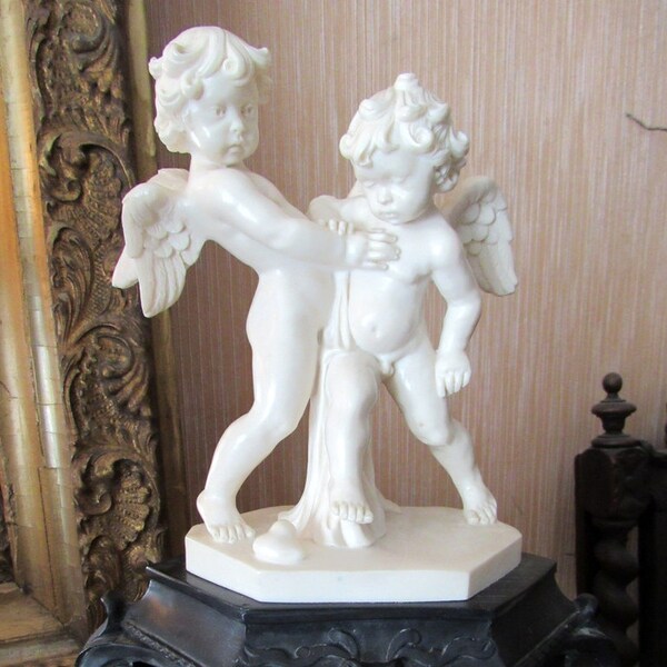 Reserved for N*******************Vintage Italian Cherubs Signed Statue