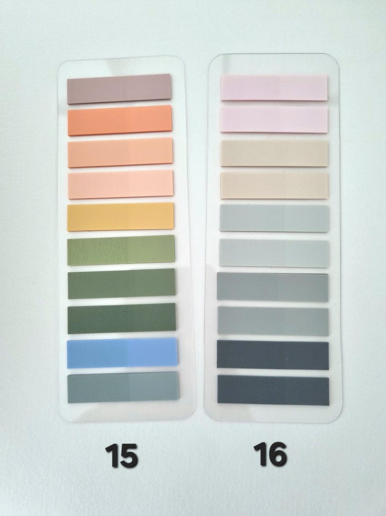 May include: Two sets of rectangular sticky notes in various pastel colors. One set is labeled "15" and includes shades of mauve, peach, pink, yellow, green, and blue. The other set, labeled "16", features pink, beige, gray, and navy blue sticky notes.