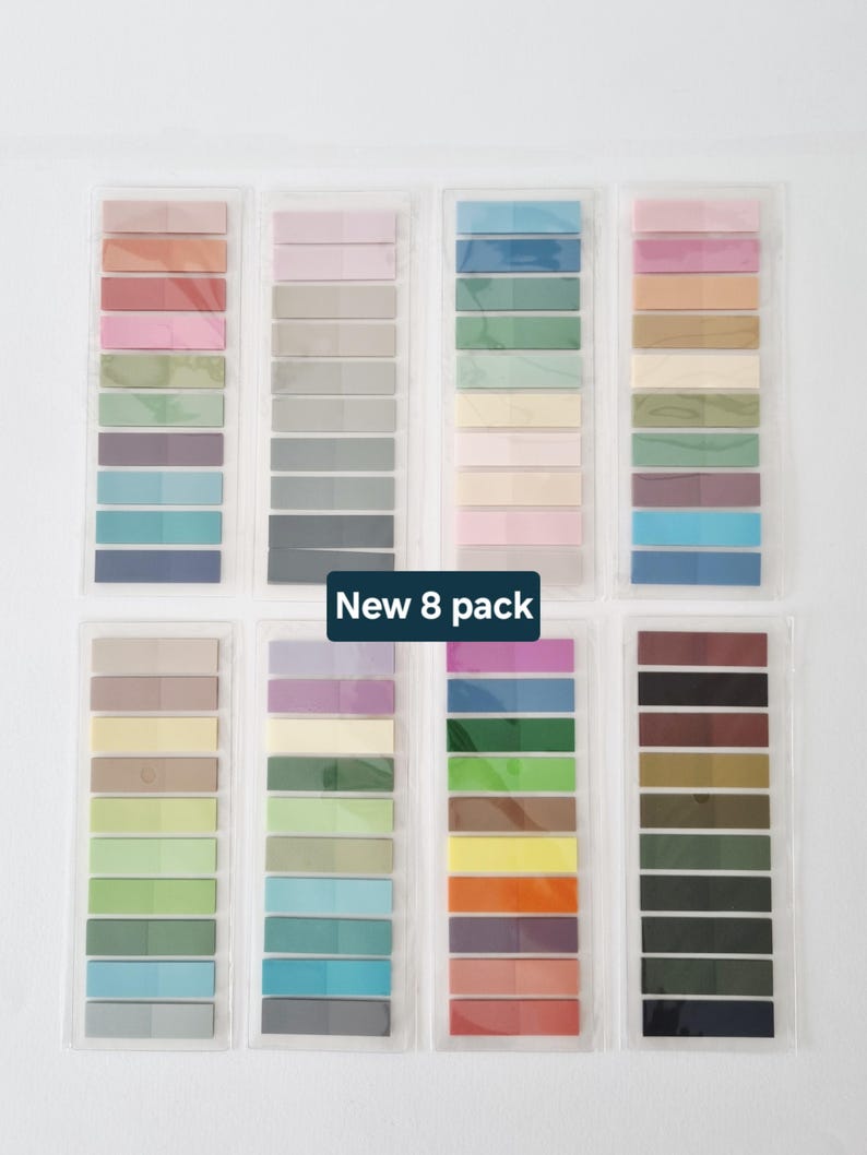 May include: Eight packs of colorful sticky notes in various shades, including pink, blue, green, and brown. Each pack contains a gradient of colors. The text "New 8 pack" is displayed on the image.