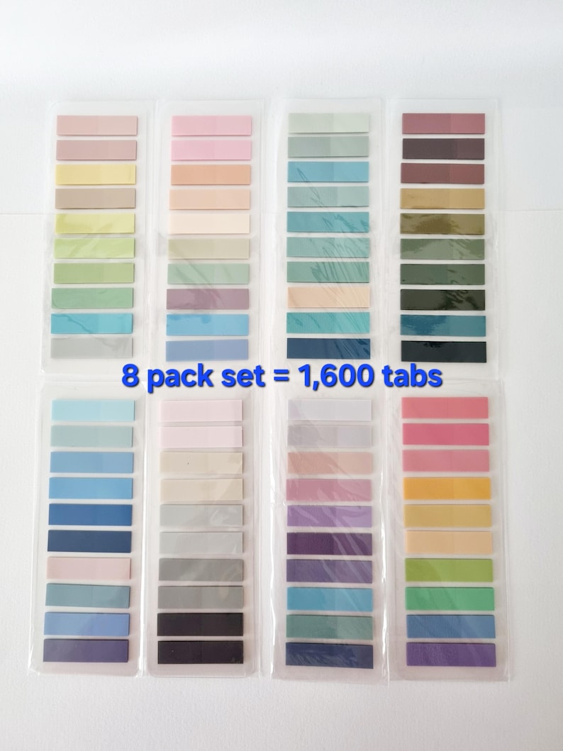 May include: Eight packs of sticky note tabs in various pastel colors, including pink, yellow, green, and blue. Each pack contains multiple tabs, with the text "8 pack set = 1,600 tabs" visible.