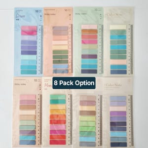 May include: Eight packs of rectangular adhesive sticky notes in various colour palettes, each featuring ten distinct shades and a printed 14 cm ruler along the side. The packaging includes labels such as Dream, Sticky notes, and Color Note.