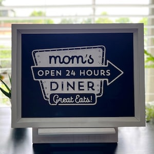 Mom&#39;s Diner, Open 24 hours and Good Eats, sign.
