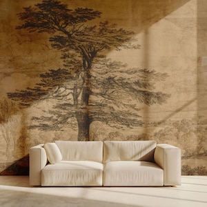 May include: A white sofa sits in front of a wall with a brown and black ink drawing of a large tree and landscape. The drawing is on a textured paper background.