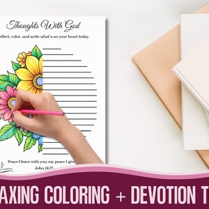 May include: A colouring book page with the text "Thoughts With God" and floral illustrations. A hand is colouring the flowers with a pink pencil. The text "Relaxing Coloring + Devotion Time" is at the bottom. A notebook is in the background.