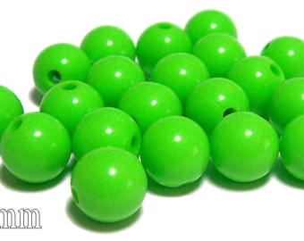 May include: A group of 15 bright green plastic beads, each measuring 10 mm in diameter.
