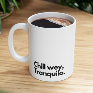 May include: White ceramic coffee mug with black text that reads "Chill wey, Tranquilo."