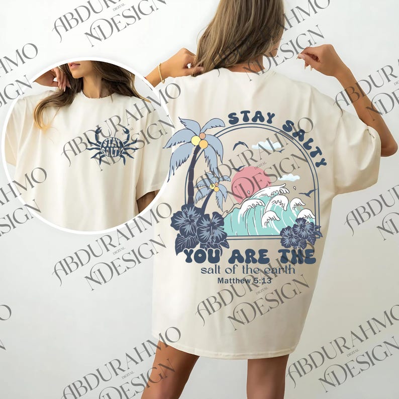 a woman wearing a white robe with a palm tree on it