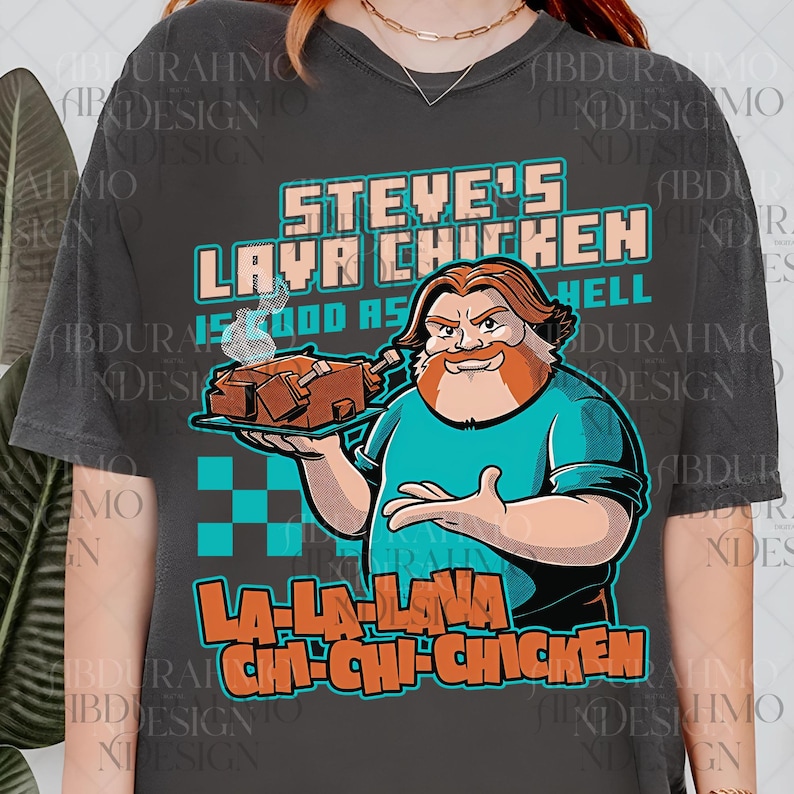 a woman wearing a t - shirt with a picture of a man holding a cake