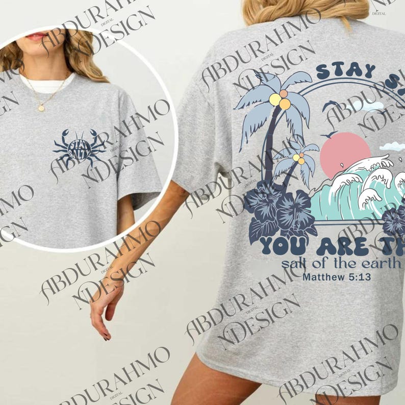 a woman wearing a gray shirt with a palm tree on it