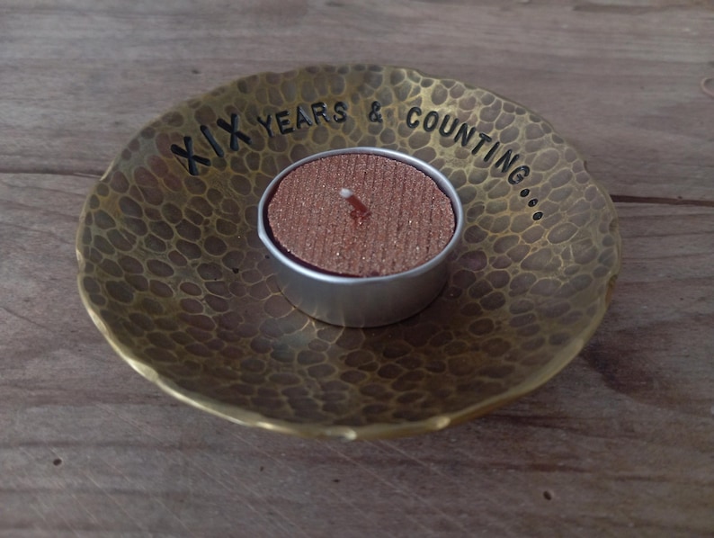 a bronze bowl candle lit holder for 8th wedding anniversary