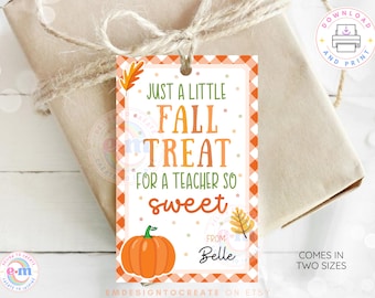 May include: A gift tag with a fall theme, featuring a pumpkin illustration and the text "Just a Little Fall Treat for a Teacher So Sweet." The tag has an orange and white checkered border and is tied to a wrapped gift.