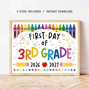 May include: A rectangular sign featuring the text FIRST DAY OF 3RD GRADE in black, red, yellow, green, blue, and purple. The design includes a row of colorful crayons at the top, a red apple between the years 2026 and 2027, and two yellow pencils.