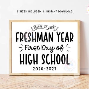 May include: A rectangular sign in a light wood frame featuring black text on a white background that reads CLASS OF 2030, FRESHMAN YEAR, First Day of HIGH SCHOOL, and 2026-2027. The design includes a banner graphic and small decorative lines.