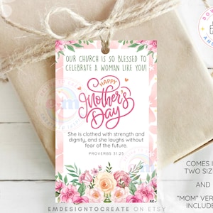 May include: A gift tag with a floral design and the text "Happy Mother's Day." The tag has a pink and white background with a floral border. The text "Our church is so blessed to celebrate a woman like you!" is at the top.