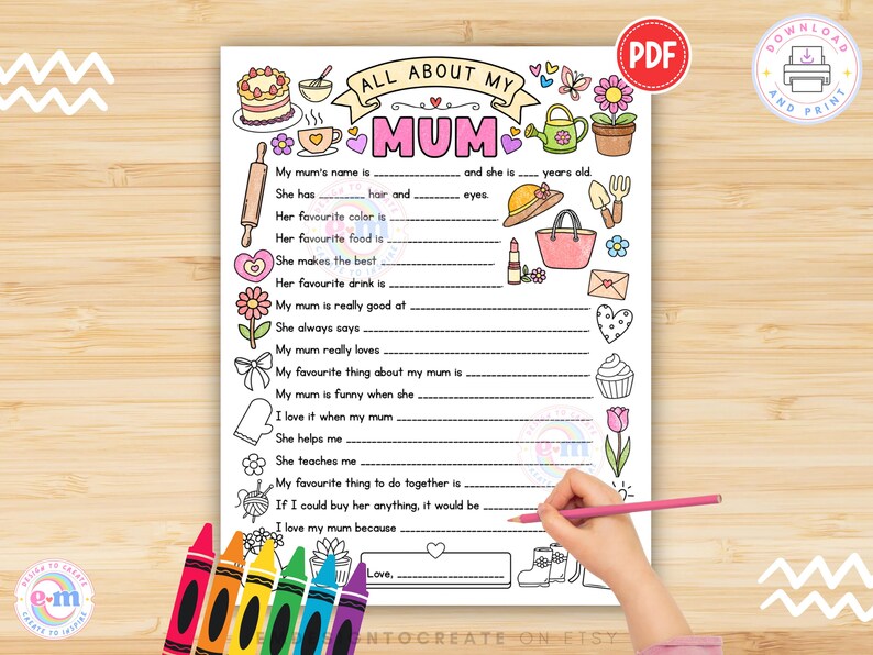 May include: A printable PDF worksheet titled "All About My Mum" with fill-in-the-blank prompts. The worksheet features hand-drawn illustrations of a cake, flowers, and other items. A hand is holding a pink pencil, filling out the worksheet.