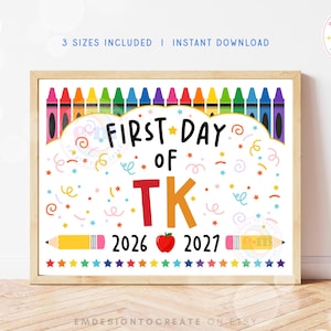 May include: A rectangular sign featuring the text FIRST DAY OF TK with a red apple between the years 2026 and 2027. The design includes a row of colorful crayons at the top, a row of stars at the bottom, and scattered confetti elements.