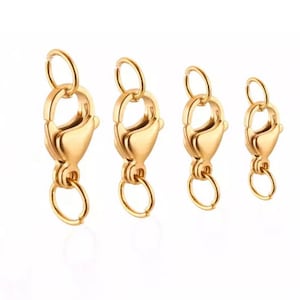 May include: Four gold-toned lobster clasps of different sizes. The clasps are made of metal and have a shiny finish.