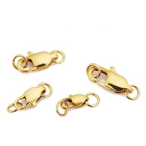 Peut inclure: Quatre fermoirs à ressort dorés de différentes tailles. Ces fermoirs sont couramment utilisés pour la fabrication de bijoux.