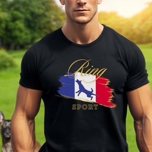 May include: A black t-shirt with a gold graphic of a dog jumping in front of a French flag with the words "Ring Sport" underneath.