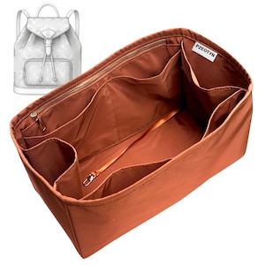 May include: A rust-coloured fabric bag organiser insert featuring multiple interior pockets, a zippered compartment, and a small attached strap with a metal clasp. A white tag with the text PZEOTYN is sewn inside. A small line drawing of a backpack is shown.