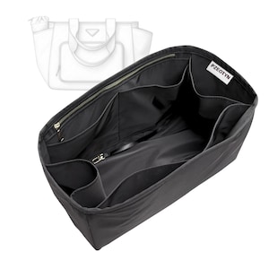 May include: Black handbag organizer with multiple compartments and a zipper closure. The organizer has a label that reads "PZEOTYN". A line drawing of a handbag is in the background.