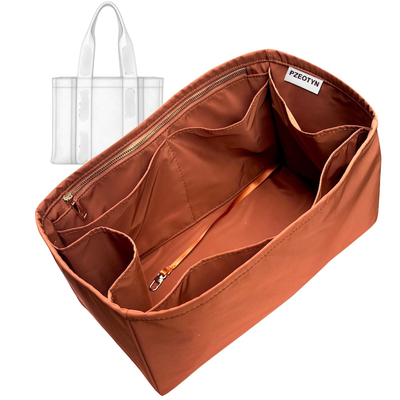 May include: A rust-colored handbag organizer with multiple compartments and a zippered top. The organizer has a light-colored strap and the brand name "PZEOTYN" is visible. A clear tote bag is in the background.