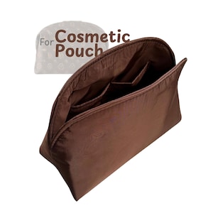 May include: A brown cosmetic pouch with several internal pockets. The pouch is open, showing the interior lining and pockets. The text "For Cosmetic Pouch" is displayed above the pouch.