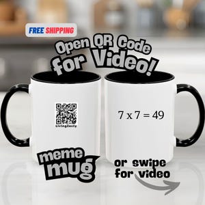 May include: White ceramic mug with a black interior, handle, and rim. One side features a QR code and the text "meme mug". The other side displays the equation "7 x 7 = 49".