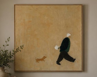 May include: A square framed wall art piece featuring a mustard yellow background with a small brown dog walking beside a person wearing a dark coat and dark trousers. The person is depicted in profile, walking toward the right side of the frame.