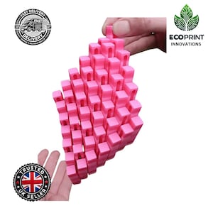 May include: A pink 3D-printed structure made of many small, rectangular blocks. The blocks are arranged in a grid, creating a larger, irregular shape. The image includes logos for "Fast Delivery" and "EcoPrint Innovations".