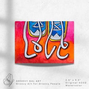 May include: A watercolor painting of two blue sneakers with yellow trim and white laces on a vibrant red, orange, and pink gradient background. The white laces are arranged to spell the word LOVE. The artwork measures 2.5 inches by 3.5 inches.