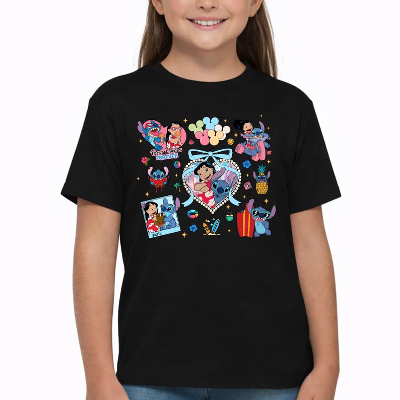 May include: A black short-sleeved t-shirt featuring a colorful graphic print of Lilo and Stitch. The design includes multiple illustrations of the characters, a heart-shaped frame with a blue bow, a polaroid-style photo, and the text Best Friends Forever.
