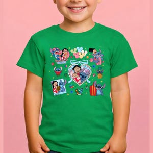 May include: A bright green short-sleeved t-shirt featuring a colorful graphic print of Lilo and Stitch characters. The design includes multiple illustrations of the pair, a heart-shaped frame, balloons, and the text Best Friends Forever.
