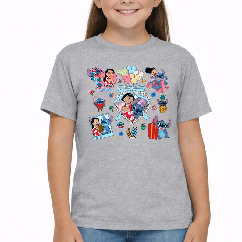 May include: A heather gray short-sleeve t-shirt featuring a colorful graphic print of Lilo and Stitch characters. The design includes various illustrations of the pair, a heart-shaped frame with a blue bow, balloons, and the text Best Friends Forever.