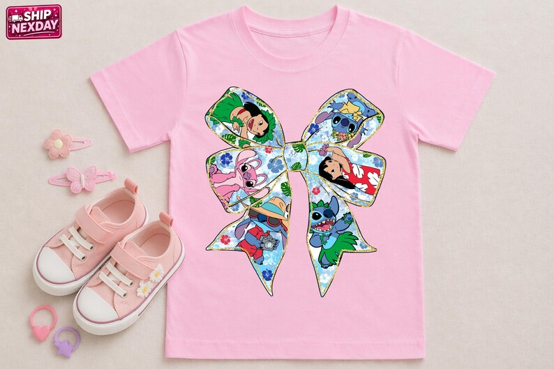 May include: Pink t-shirt with a large bow design featuring Stitch and Lilo characters. The bow is filled with colourful images of the characters. Pink trainers, hair clips, and a hair tie are also in the image.