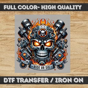 May include: A detailed graphic of a skull with fiery orange eyes and flames, surrounded by engine components. The design includes the text "RIDE OR DIE" on a banner. The image is labeled "FULL COLOR - HIGH QUALITY" and "DTF TRANSFER / IRON ON".