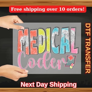 May include: A colorful iron-on transfer design with the text "MEDICAL Coder" in a playful font. The letters are outlined in black and have a textured, glittery appearance. The design includes a small image of a medical prescription with a plus sign and a pill.