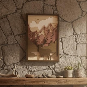 May include: A framed wooden artwork of a deer in a mountain scene hangs on a stone wall. A wooden shelf below holds a deer antler, stones, and potted plants. The room has a rustic, natural theme, with a window view.