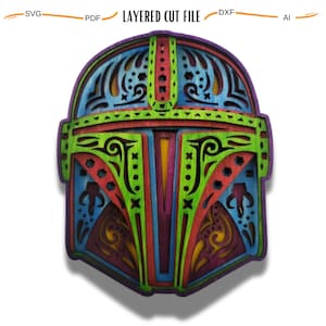 May include: A colorful, layered, wooden cut-out design of a Mandalorian helmet. The helmet is decorated with intricate patterns and is a vibrant mix of green, red, blue, and yellow.