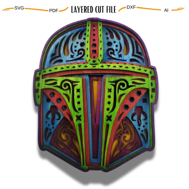 May include: A colorful, layered, wooden cut-out design of a Mandalorian helmet. The helmet is decorated with intricate patterns and is a vibrant mix of green, red, blue, and yellow.
