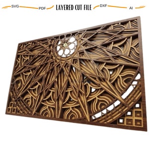 May include: A layered wooden wall art piece with a geometric design in shades of brown. The design features a central starburst with intricate details and a circular pattern.