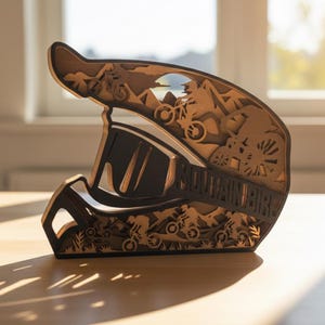 May include: A wooden sculpture of a mountain bike helmet. The helmet is brown and black, with the words "MOUNTAIN BIKE" on the side. The design features mountain bikers and mountain scenery.