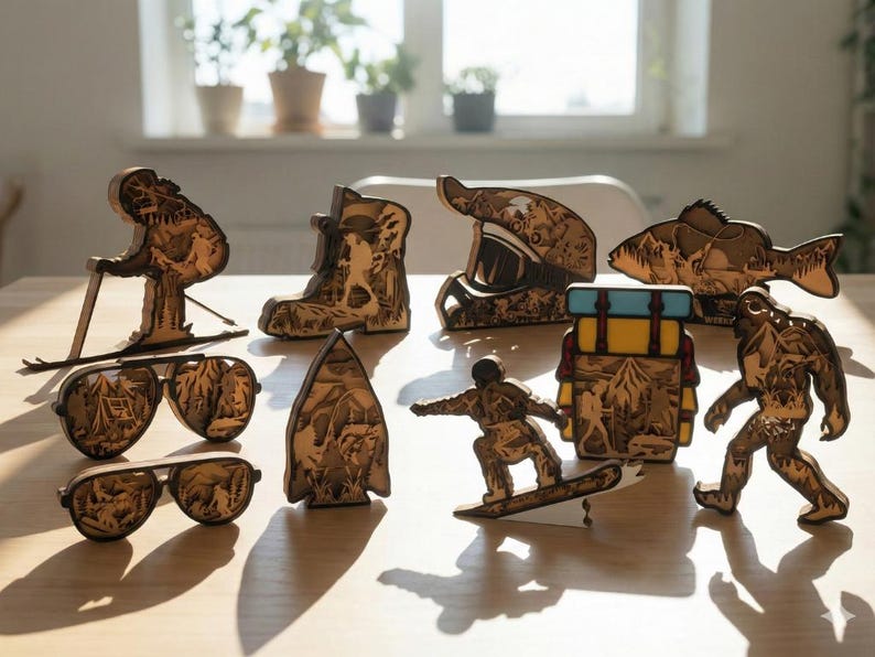 May include: Wooden laser-cut figurines of outdoor adventure themes, including a skier, snowboarder, backpack, fish, Bigfoot, and a motorcycle helmet. Also included are two pairs of sunglasses with mountain scenes.