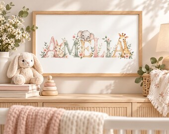 May include: A rectangular wooden frame containing a white print with the name AMELIA in large, decorative letters. The letters are adorned with watercolor illustrations of a rabbit, an elephant, a giraffe, and various pink flowers and green leaves.