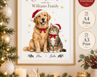 May include: A framed wall art print featuring a golden retriever and a tabby cat wearing red Santa hats and festive bows. The text reads Christmas with the Williams Family and Max and Bella. The design includes gold snowflake accents on a white background.