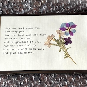 Handmade Aaronic Blessing using a typewriter on linen paper with pressed flowers. 6 frame types