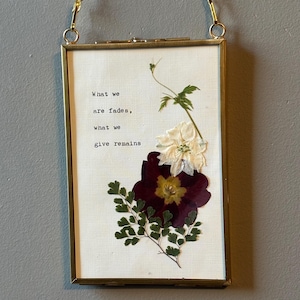 Being Human Art: words on giving back with pressed flowers and 6 frame options.