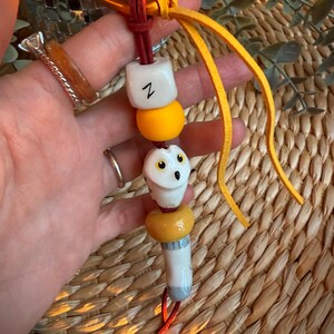 A charming handmade owl decoration for a big or pants\jeans. Hedwig, a character from potter.