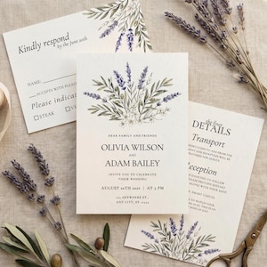May include: Wedding invitation suite featuring lavender and greenery. The main invitation includes the names Olivia Wilson and Adam Bailey, wedding date, and time. RSVP and details cards are also included.